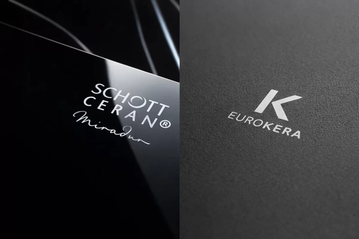 Cận cảnh mặt kính: Một bên là logo Schott Ceran của Đức trên bếp Chefs với độ bóng như gương, một bên là logo chữ K (EuroKera) của Pháp trên bếp Malloca với bề mặt nhám mờ tinh tế
